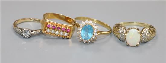 Four assorted dress rings including 18ct gold and diamond.